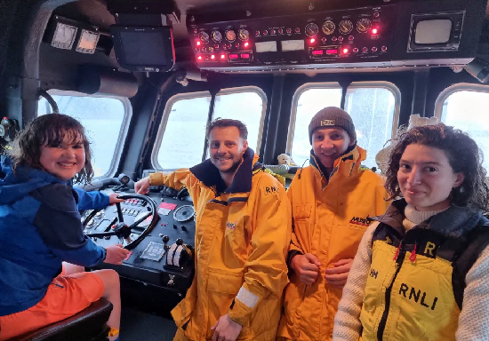 Catalina McManus getting a guided tour of Fowey RNLI lifeboat station after she raised more than £1,200 with a sponsored walk 