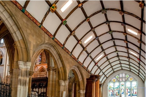 St Mary’s Aisle, featuring some of the stained glass and ceiling bosses  