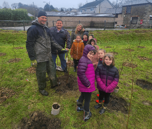 The tree planting in bad weather at Tregrehan Mills