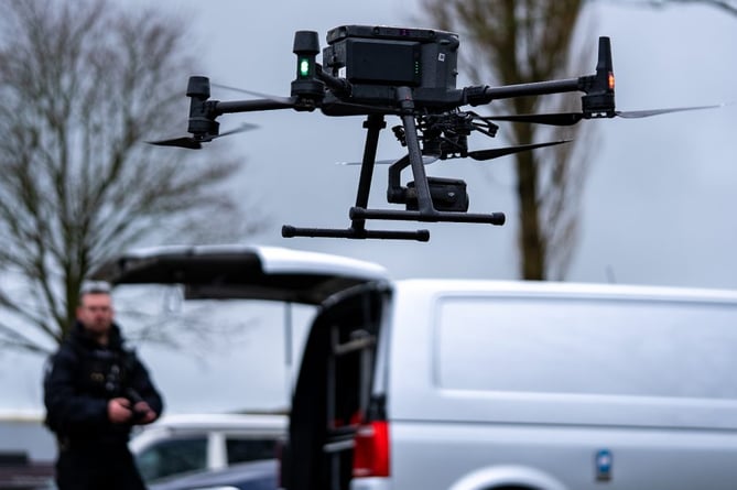A Devon & Cornwall Police drone operator. See SWNS story SWMRdrone; UK Police are using DRONES to detect driving offences. Devon & Cornwall Police say their drone unit have linked up with their roads policing team in order to track dangerous motorists on high harm routes. The move comes as part of National Motorcycle Safety Week (April 3-9), with the drones tracking vehicles' speeds live using fixed positions on roads. The force says that the drones will also be able to video all road incidents along specific, dangerous stretches of road where the project is running - meaning any dangerous or inappropriate driving will be caught on camera.
