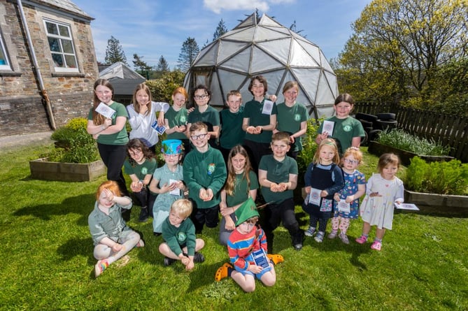 Lostwithiel Primary School pupils planting seeds provided by the Department of Education and the Eden Project to mark the coronation