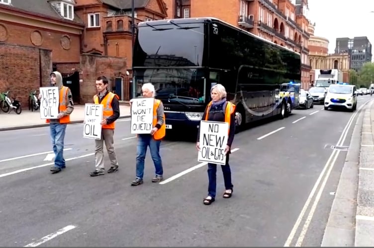 Just Stop Oil activists hold up the England crickets teamâs coach on itâs way to a Test match against Ireland. See SWNS story SWMRcricket. Eco-activists who blocked the England cricket team's coach on its way to a match joked the "players might know a bit about a batting collapse". Just after 8:30am four demonstrators walked in front of traffic near Hyde Park, central London, stopping the England players reaching Lords where they were due to play a Test against Ireland. The protesters seemed unaware they were blocking the England team bus, until wicket keeper and batsman, Jonny Bairstow, posted a picture on Instagram showing demonstrators and police in front of their coach.