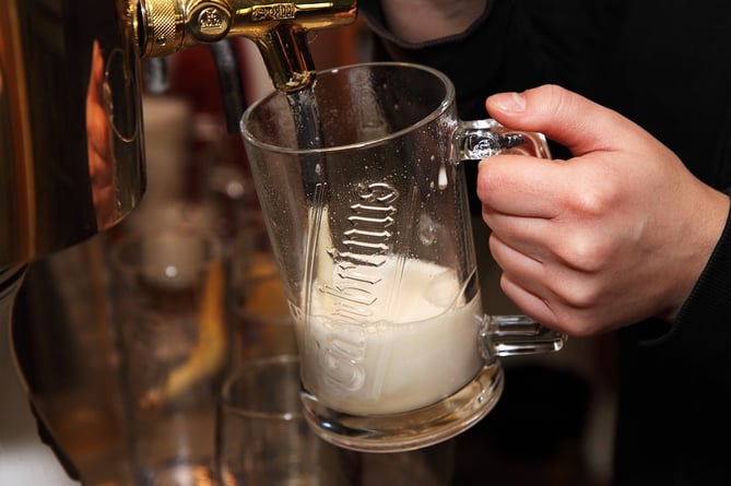 Pint of beer being poured