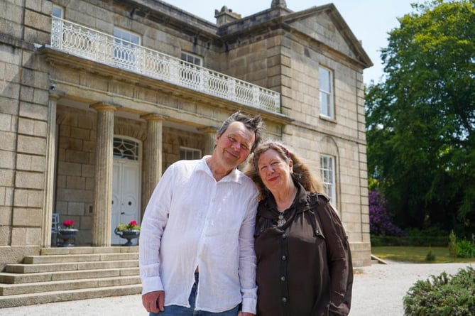 Reg and Elizabeth Price outside the restored Roswaren House