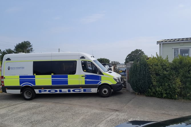 Police searching the rural property in Camborne