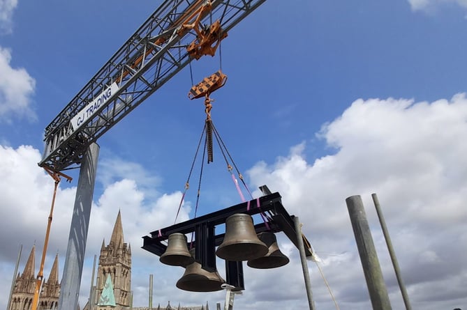 The refurbished bells were craned back into position in Truro's historic clock tower 