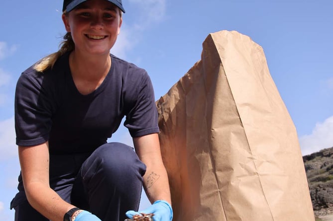 AB (HM) Megan Page participating in a beach clean up in Curacao.