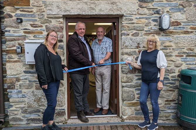PARISH council chairman Haviland Bunt (centre left) and steering group chairman Joe Rowe cut the ribbon on the new St Neot Village Shop flanked by owner Tina Lapthorne and Katie Martin