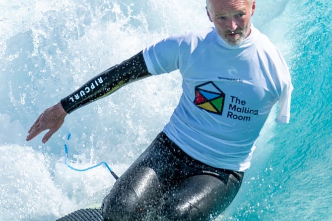 Stephen Downes in surfing action 