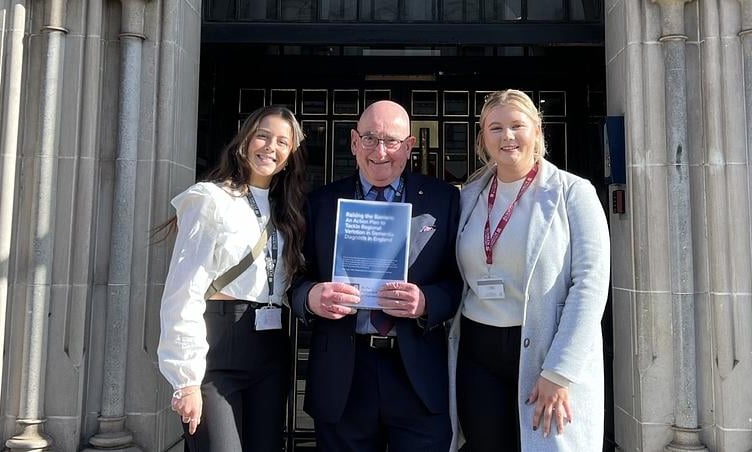 Chloe French and Leah Vincent outside the Houses of Parliament with demenita academic lead Ian Sherriff