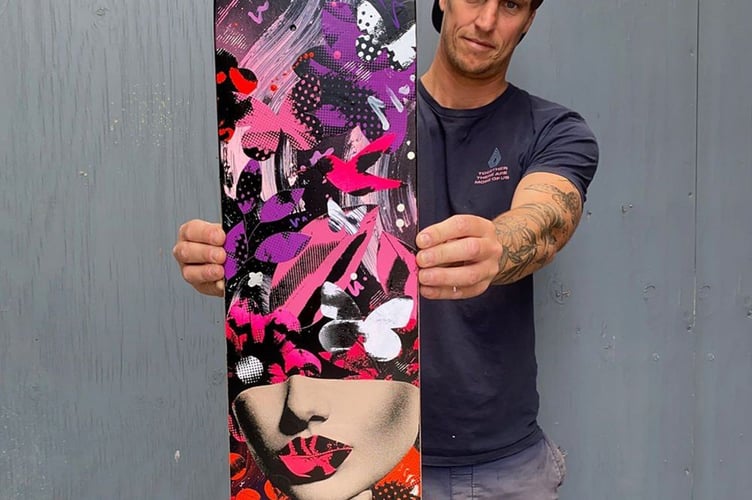 Artist Olly Howe with his skateboard deck design