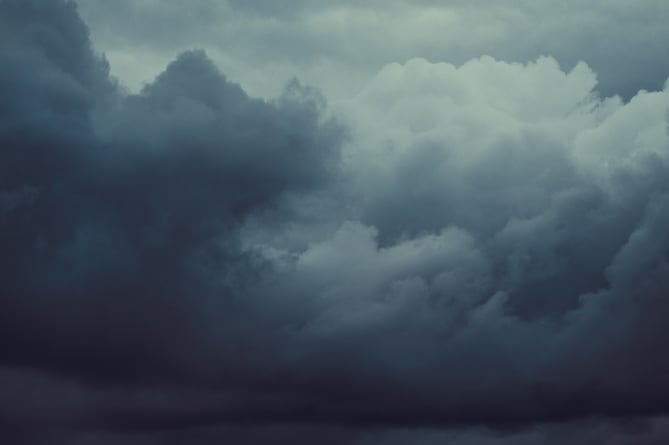 Storm sky with dark grey cumulus clouds.  Thunderstorm