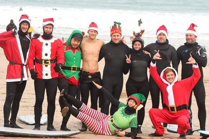 Santa and his helpers hit the surf in Newquay for good cause