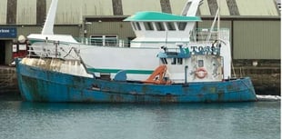 Bid to get rid of boat left to rot in harbour