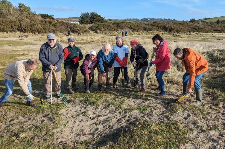 The Friends of Par Beach group with their new tools for tackling invasive plants 