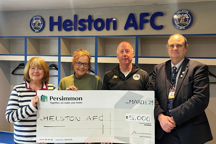 Helston Athletic receiving the cheque. From left: Sandra Egan (club treasurer), Jane Cartwright, Paul Hendy and Cllr Guy Foreman.