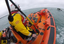 RNLI called to reports of three people clinging onto a surfboard out at sea 