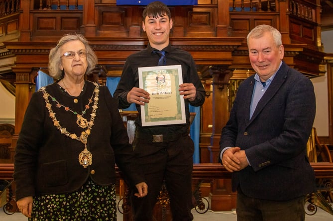 Harry Stoddern receives his award from Cllr Carol Swain and Malcolm Bell 
