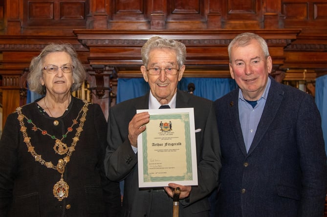 Arthur Fitzgerald receives his award from Malcolm Bell and  Cllr Carol Swain 