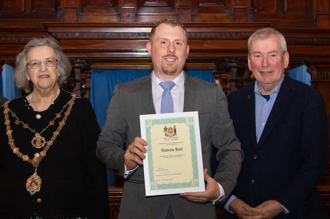 Andrew Hall receives his award from Cllr Carol Swain and Malcom Bell 