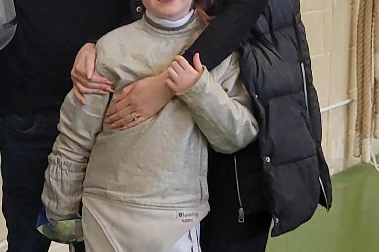 Champion fencer Beatrix with parents Dax and Jade