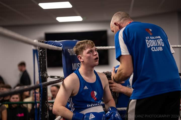 St Columb coach Paul Doust speaks to Max Brownnig between rounds