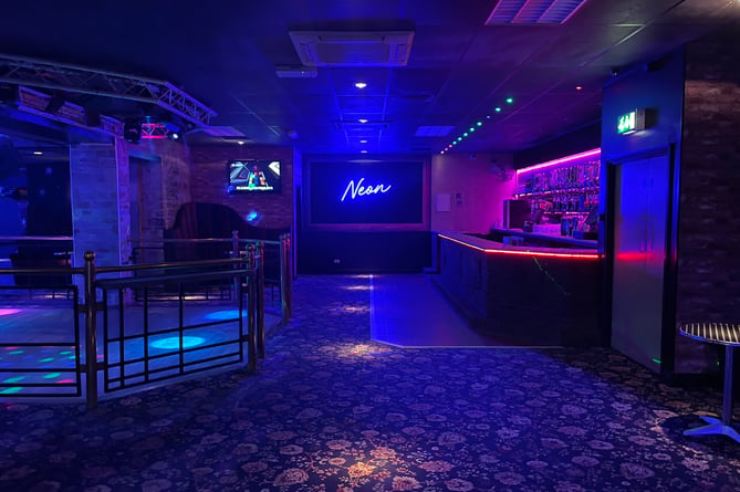 Upon entering the nightclub, revellers immediately are greeted with a colourful new identity - with the UV lights and a new carpet to follow (Picture: Aaron Greenaway)