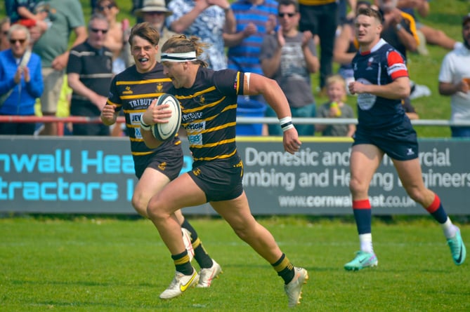 Former Bude youngster Duncan Tout, who now plays for Tonbridge Juddians in Kent, runs in a try during his man of the match performance at Redruth on Saturday.