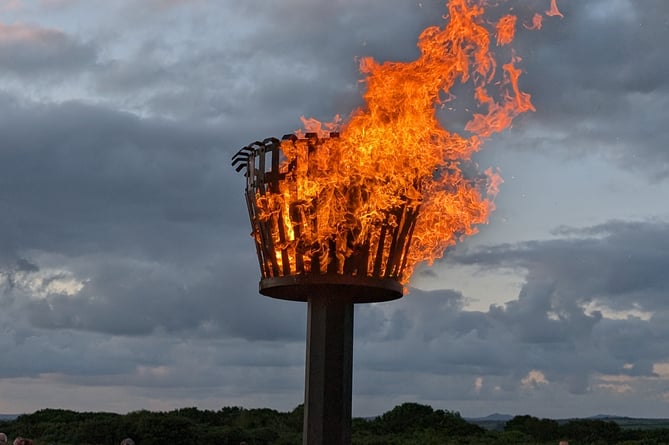 A flame was lit on the memorial beacon erected as part of the '80 Beacons' initiative