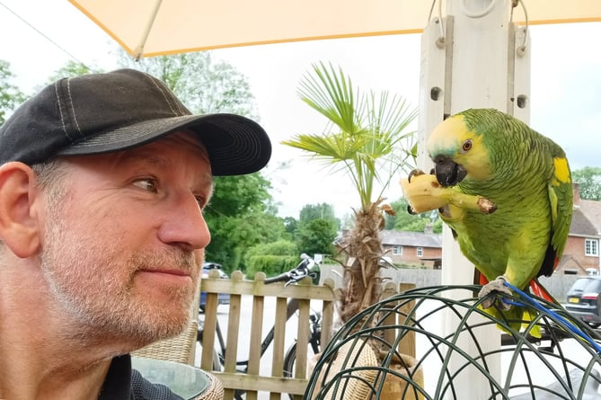 Paul Blowers with his Parrot Kiki