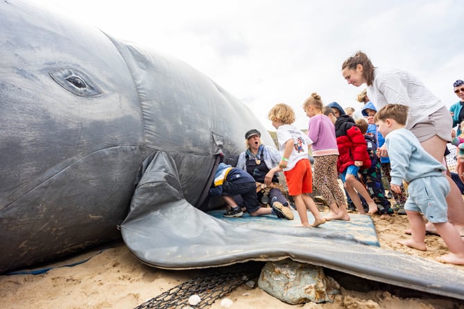 Wildcard - Arts On The Beach event at Watergate Bay. A free family weekend of whale theatre, aerial performance, a 13-foot roaming puppet, dance, music and creative workshops. The second Arts on the Beach event following its inauguration last year. Newquay, Cornwall. June 15 2024.