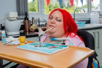Paralysed woman overcame the odds to paint with her mouth