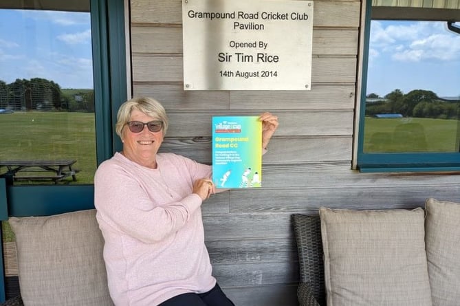 Grampound Road CC secretary Di Pearce with the certificate to show they have been shortlisted.