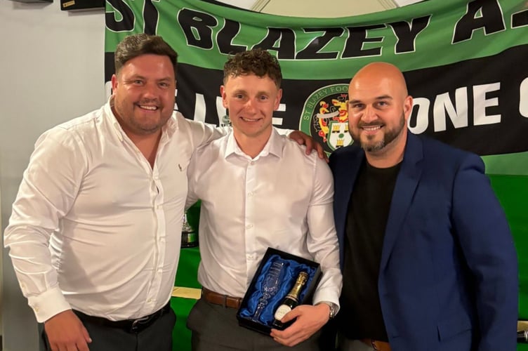 Left-back Reece Carroll with the 'Champagne Moment of the Year' award for his brilliant goal at Clevedon Town. Picture: St Blazey AFC