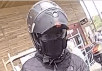Police release further image of man wanted in connection to an armed robbery