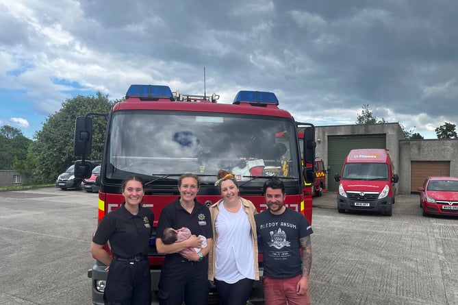 Baby Olive and parents with firefighters Rosie and Katie