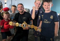 Boxer receives a hero's welcome after winning British title