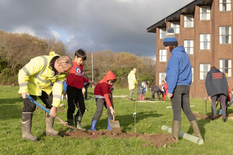 Today, RAF St Mawgans whole force, along with children from Airplay Cornwall, staff from the Eden project, National Wildflower Centre, and Vivo Defence helped plant 370 fruit trees at 4 sites across the estate as part of the Queen green Canopy initiative.

The newly planted orchards with officially unvailed by Councillor Martyn Alvey, Cabinet member for environment and climate change  and the Station Commander, Wing Commander Marshall Kinnear.