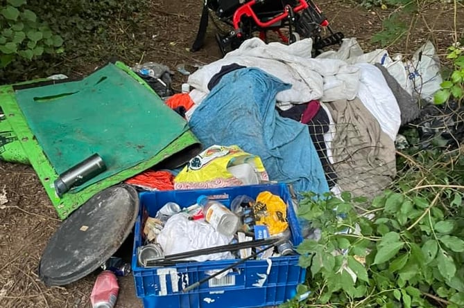 Needle wrappers and rubbish left at the community orchard within the grounds of New County Hall in Truro