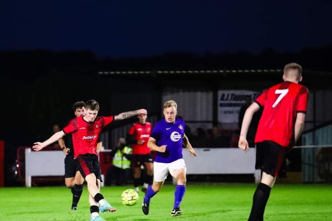 Charlie Castlehouse bangs in a superb third goal for Dobwalls against Millbrook at Lantoom Park on Wednesday night. Picture: Colin Hilton