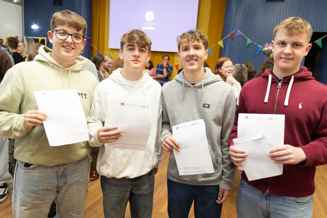 Gabriel, Samuel, Thomas, and James share a triumphant moment, celebrating their collective success on results day