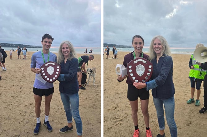 Mayor of Hayle, June Lawrenson Reid presents the prizes to the male and female winners of the recent St Ives Bay 10K, which was run by Hayle Runners.
Left is men's winners Andrew Heyes from Dark Peak Fell Runners, while Lauren Heyes (Hallamshire Harriers Sheffield) was the first lady over the line. Pictures: Hayle Runners