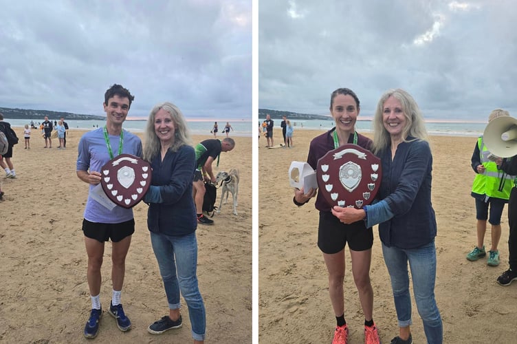 Mayor of Hayle, June Lawrenson Reid presents the prizes to the male and female winners of the recent St Ives Bay 10K, which was run by Hayle Runners.
Left is men's winners Andrew Heyes from Dark Peak Fell Runners, while Lauren Heyes (Hallamshire Harriers Sheffield) was the first lady over the line. Pictures: Hayle Runners