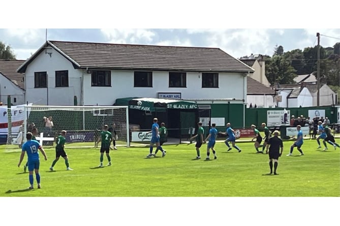 A Tom Payne free-kick causes problems in the St Blazey penalty area. Picture: Kevin Marriott.