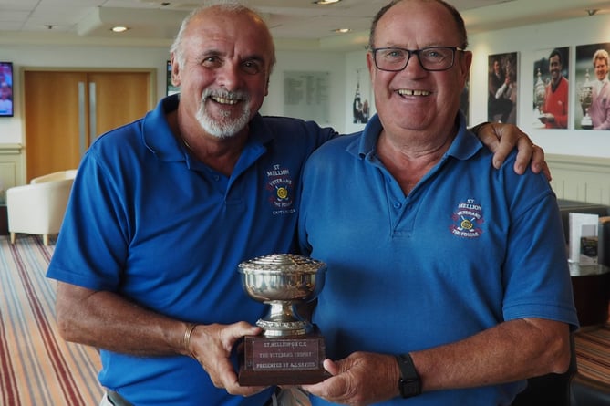 Mike Tamblin (right) receives the Veterans Trophy after his superb score of 40 points from Fossils captain Chris de Beaufort. Picture: St Mellion Golf Club