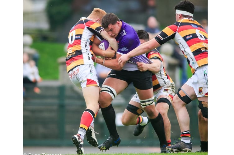 Cornish Pirates' stand-in captain for the afternoon, Hugh Bokenham, drives at the Carmarthen Quins defence. Brian Tempest