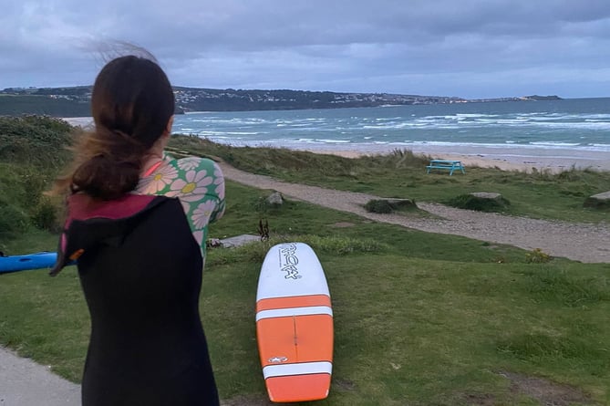 Elsie Berriman who surfs to school from Hayle to Carbis Bay in Cornwall. Release date September 13 2024. Meet the 13-year-old girl who surfs to school everyday - powering through jellyfish stings during the unique commute.  Elsie Berriman paddles on a board across the sea from Hayle to Carbis Bay in Cornwall. Waking up at the crack of dawn Elsie gets in the water at 6:30am - where it takes roughly an hour to get to Carbis Bay - usually arriving at around 7:45am. The determined surfer then uses the outdoor showers on the beach in her wetsuit, gets ready and heads up to school. She is doing the school commute surf on an epic fundraising mission for her local surf club.