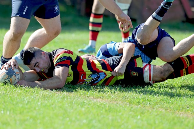 Saltash flanker Phil Eatwell dives over for a try against Bodmin on Saturday. Picture: Glen Rogers