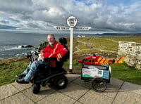 Steven reaches Land's End in his electric wheelchair