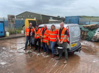 Waste firm workers clean up for charity with a car wash